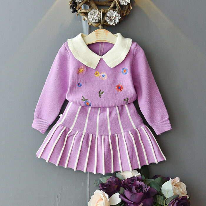 Young girl smiling in a stylish and comfortable girls long sleeve skirt set.
