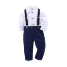 Handsome little boy dressed in a stylish boys formal gentleman terno.