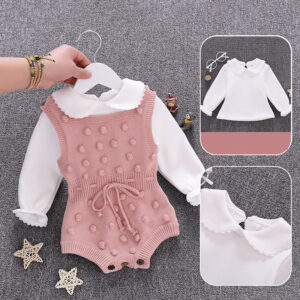 Cute baby girl wearing a cozy, minimalist baby girl long sleeve romper.