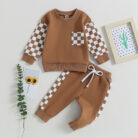 Stylish toddler boy wearing a cool boys checkered sweater terno set.