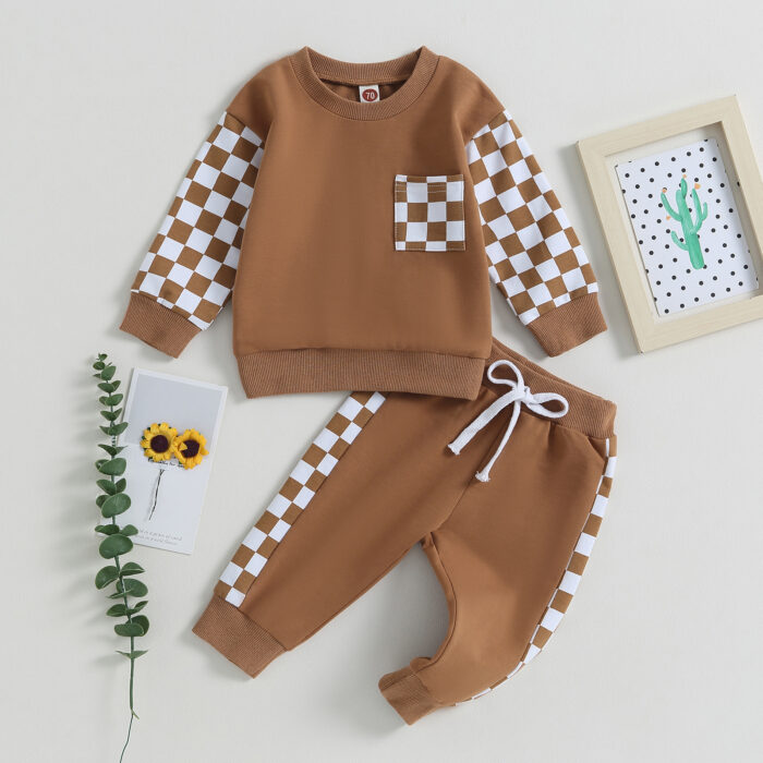 Stylish toddler boy wearing a cool boys checkered sweater terno set.