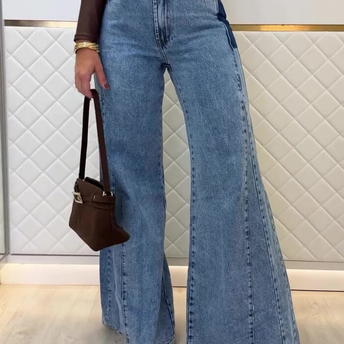 Woman wearing stylish women's high waisted flare jeans in a light blue wash.