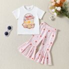 Cute toddler girl smiling and wearing a trendy toddler girl bell bottom outfit with a floral print.