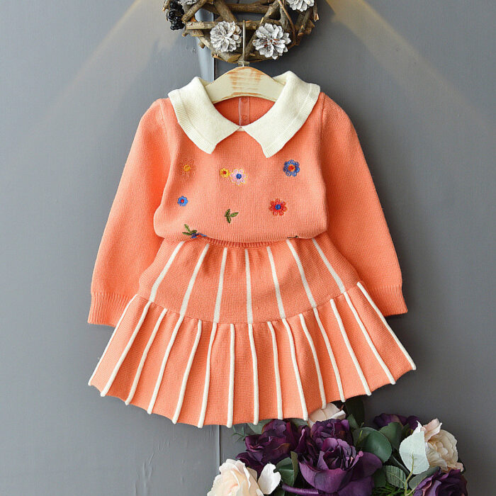 Young girl smiling in a stylish and comfortable girls long sleeve skirt set.