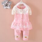 Cute toddler girl smiling in a comfortable toddler girl tracksuit set.