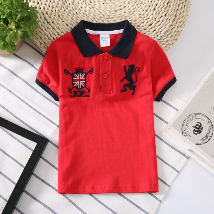 Young boy wearing a comfortable Boys Classic Short Sleeve Polo Shirt.