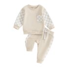 Stylish toddler boy wearing a cool boys checkered sweater terno set.