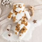 Adorable baby wearing a cozy milky white baby bear velvet terno set.