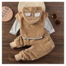 Handsome toddler boy smiling in a stylish boys 3 piece hoodie terno set.