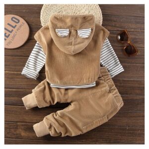 Handsome toddler boy smiling in a stylish boys 3 piece hoodie terno set.