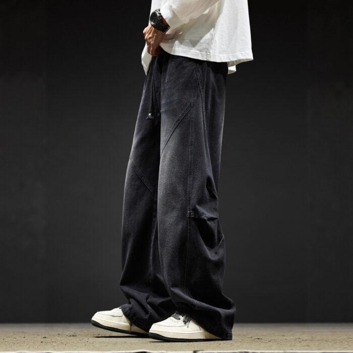 Stylish young man wearing trendy mens wide leg denim cargo pants.