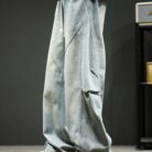 Stylish young man wearing trendy mens wide leg denim cargo pants.