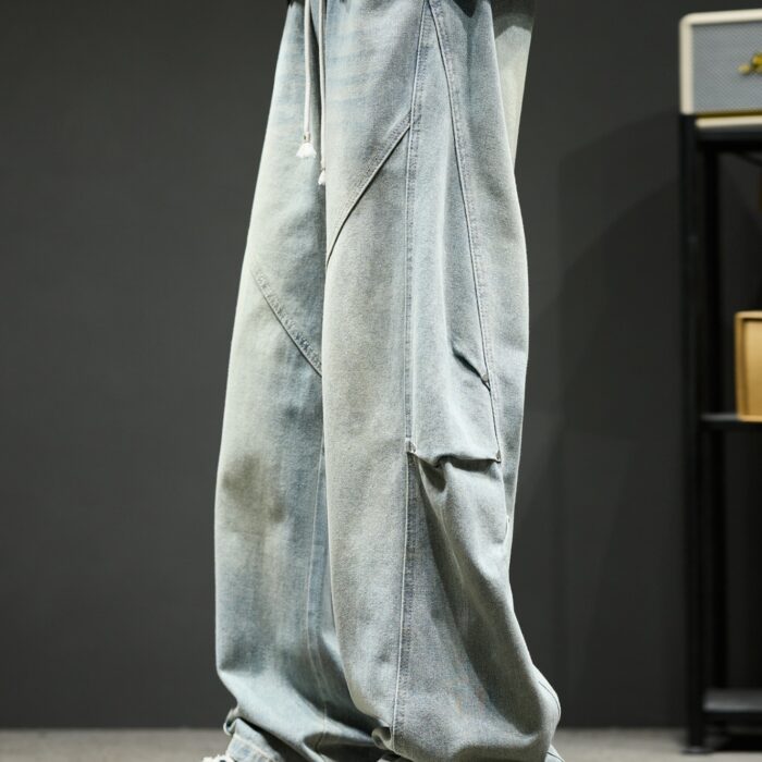 Stylish young man wearing trendy mens wide leg denim cargo pants.