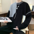 Handsome young man wearing a stylish mens colorblock pullover sweater.