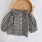 Adorable baby girl wearing a trendy boho baby girl suspender romper.