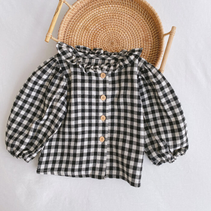 Adorable baby girl wearing a trendy boho baby girl suspender romper.
