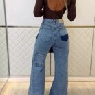 Woman wearing stylish women's high waisted flare jeans in a light blue wash.