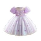 Happy little girl twirling in a beautiful girls short sleeve princess dress.