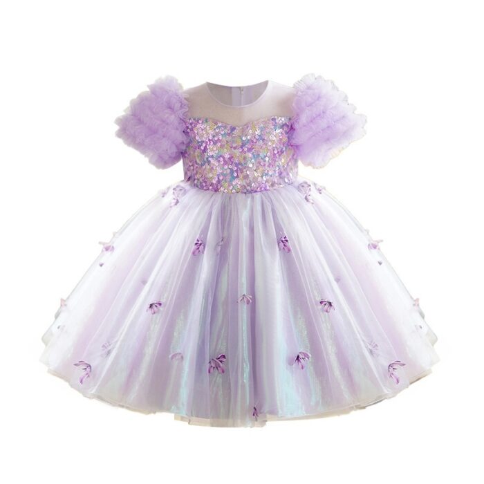 Happy little girl twirling in a beautiful girls short sleeve princess dress.