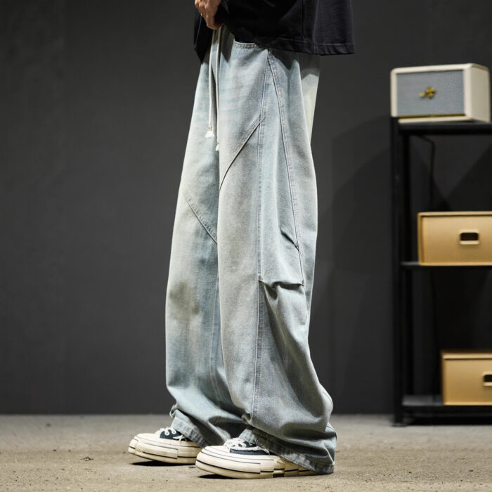 Stylish young man wearing trendy mens wide leg denim cargo pants.