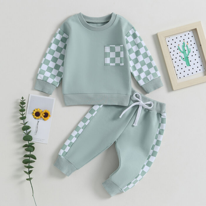 Stylish toddler boy wearing a cool boys checkered sweater terno set.