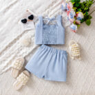Cute little girl wearing a pink girls floral terno shorts with rose petal details.