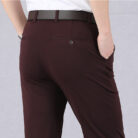 A stylish man wearing perfectly tailored mens high waist trousers ph for a smart casual look.