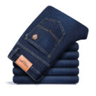 Handsome young man wearing comfortable mens straight leg jeans.
