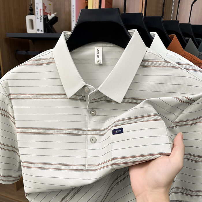 A stylish man wearing a comfortable mens striped polo shirt for a smart casual weekend look.