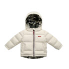 Close-up of the thick thermal cotton insulation and smooth zipper on a kids padded winter jacket.
