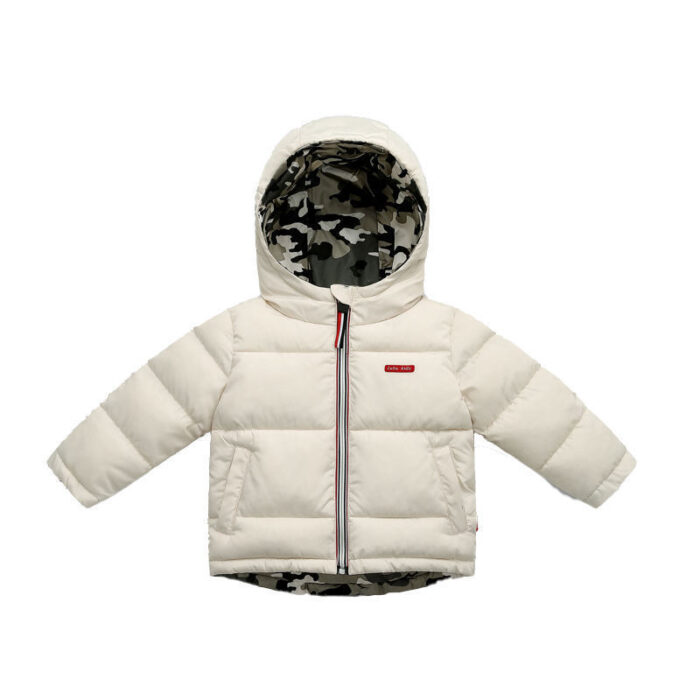 Close-up of the thick thermal cotton insulation and smooth zipper on a kids padded winter jacket.