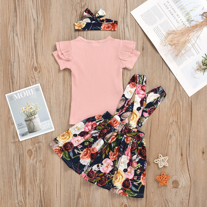 Cute little girl wearing a pink girls suspender skirt terno.