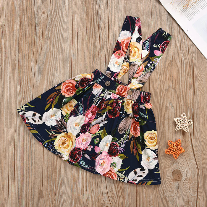 Cute little girl wearing a pink girls suspender skirt terno.