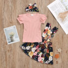 Cute little girl wearing a pink girls suspender skirt terno.