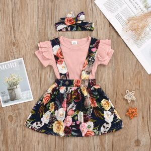 Cute little girl wearing a pink girls suspender skirt terno.