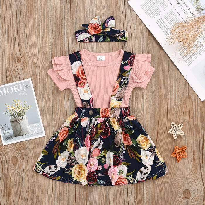 Cute little girl wearing a pink girls suspender skirt terno.
