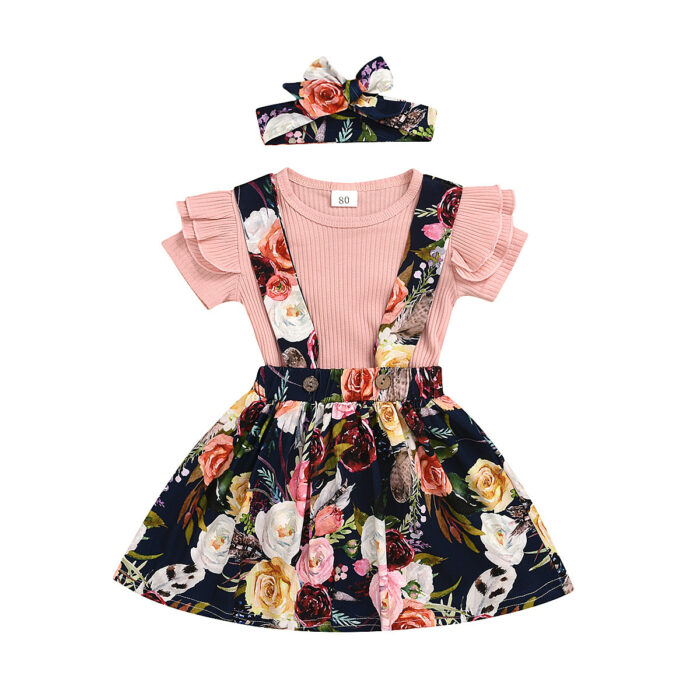 Cute little girl wearing a pink girls suspender skirt terno.