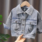 A stylish little girl wearing a versatile girls denim jacket for a cute everyday look.