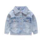 A stylish little girl wearing a versatile girls denim jacket for a cute everyday look.