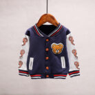 A happy child wearing a comfortable kids lightweight jacket ready for outdoor play.