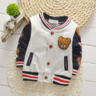 A happy child wearing a comfortable kids lightweight jacket ready for outdoor play.