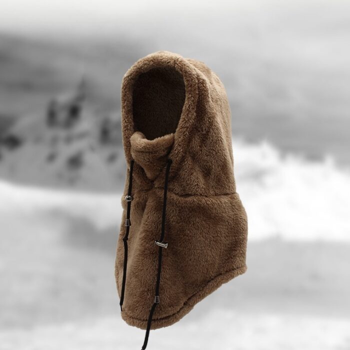 Person staying warm while wearing a thick winter fleece balaclava hat.