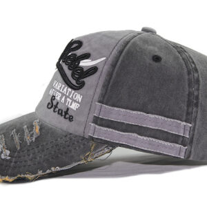 Close-up of the premium breathable cotton and classic curved brim on a distressed classic dad hat.