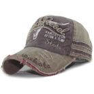 Close-up of the premium breathable cotton and classic curved brim on a distressed classic dad hat.