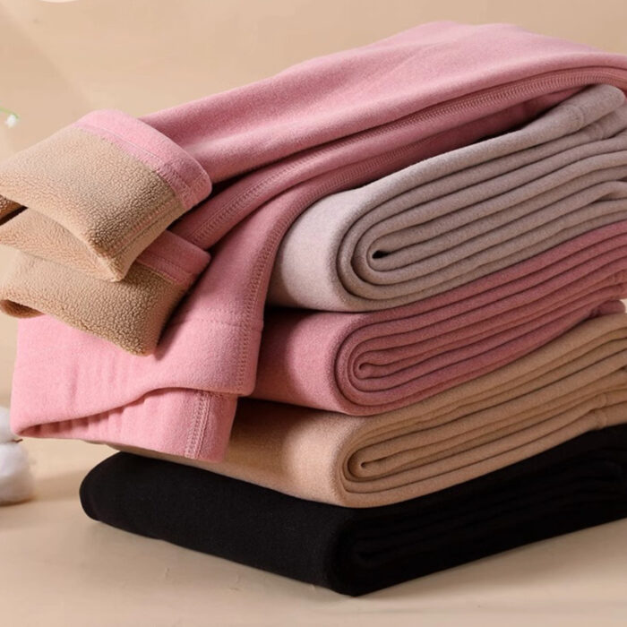 Stylish woman staying warm in thick womens thermal winter leggings for travel.