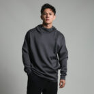 Stylish young man wearing a trendy mens loose high neck sweater.