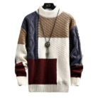 Stylish young man wearing a trendy mens korean style sweater.