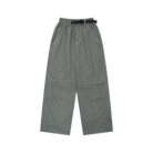 Close-up of the water-repellent nylon fabric and elastic drawstring on waterproof outdoor pants for kids.