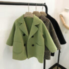 A cute toddler wearing a stylish toddler fall and winter coat for cold weather.