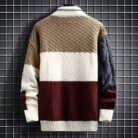 Stylish young man wearing a trendy mens korean style sweater.